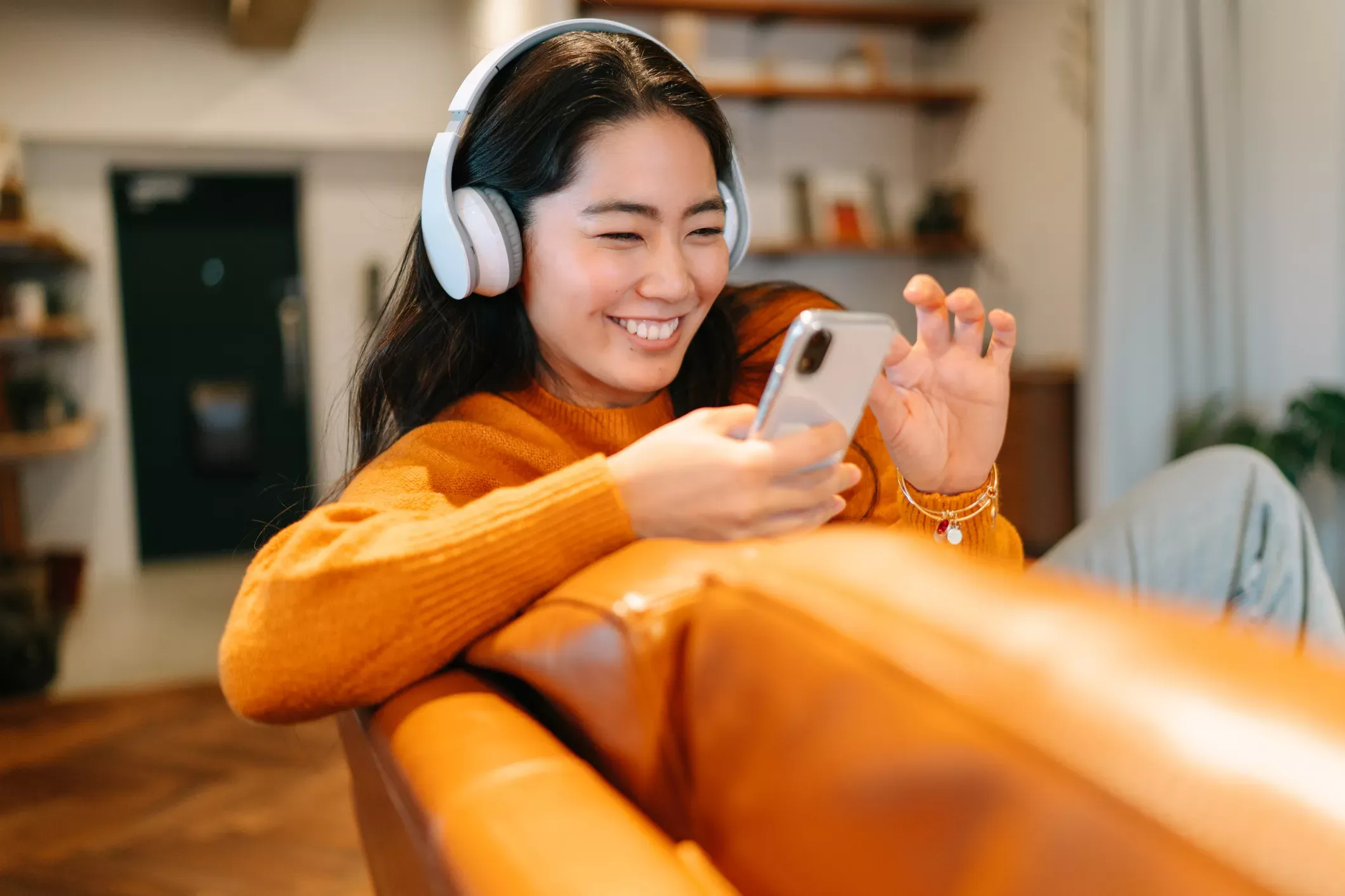 Happy woman streams fast fiber internet using her phone